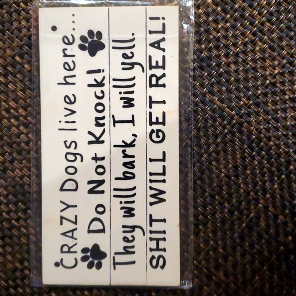 Crazy dogs sign..on a thin piece of wood.  Sign is 8x4.  Brand new.